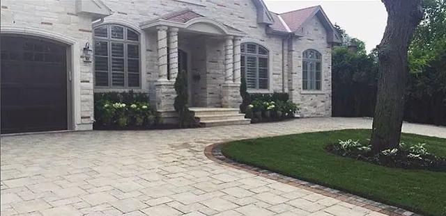 Interlock driveway beside a new lawn