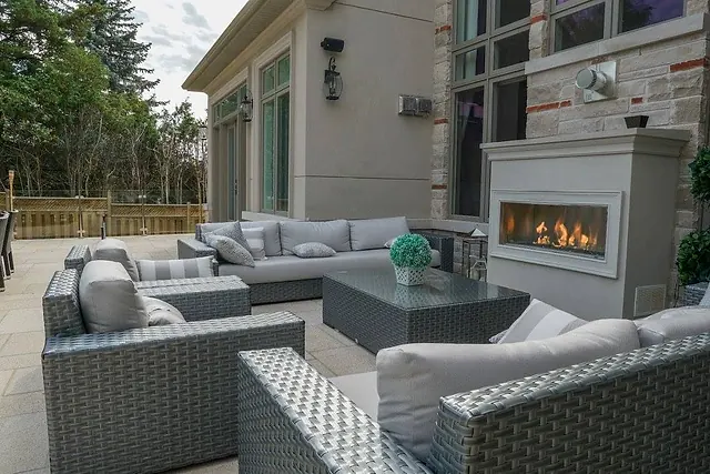 Outdoor living room with a fireplace