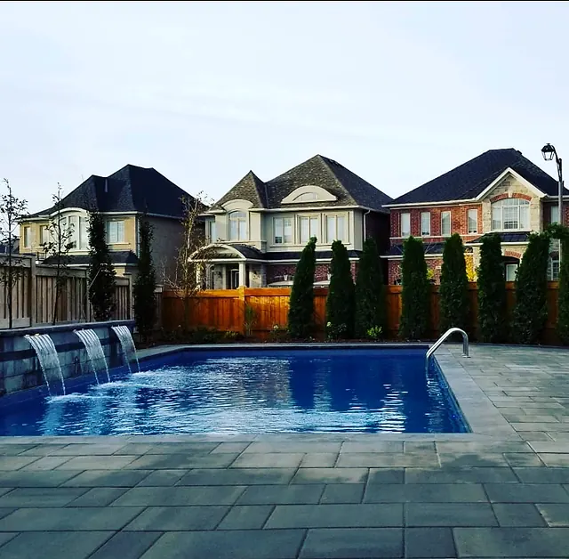 Pool with three sheer-descent waterfalls