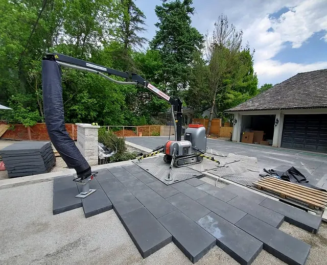 Large patio slabs set with a vacuum lifter